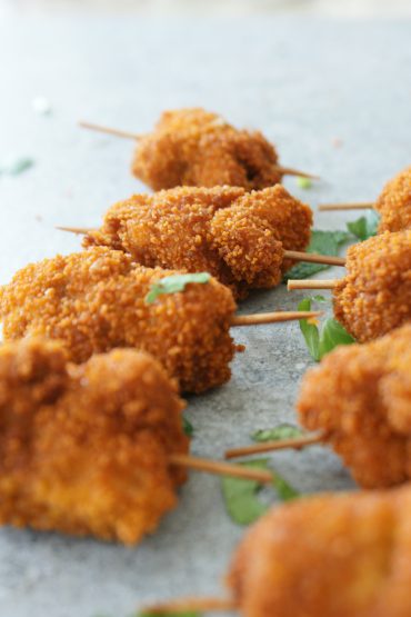 Fried breaded chicken sticks