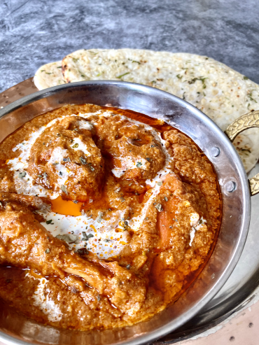 Butter chicken served with naan